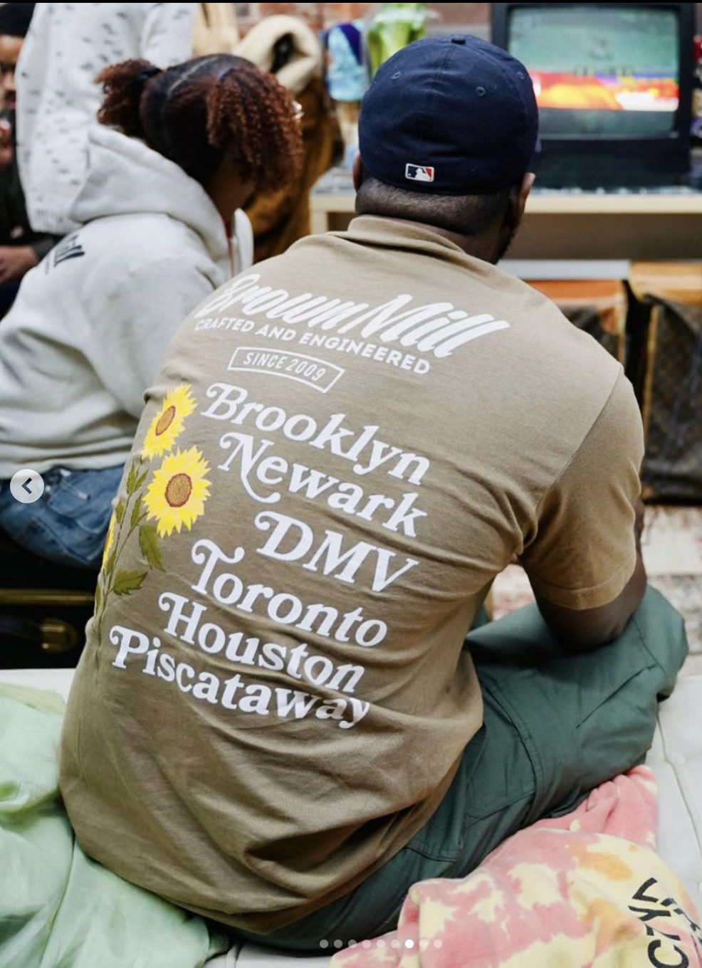 Photo of a man in Brownmill apparel inside of their shop on Halsey Street. Credit: instagram / Bikier Hayes