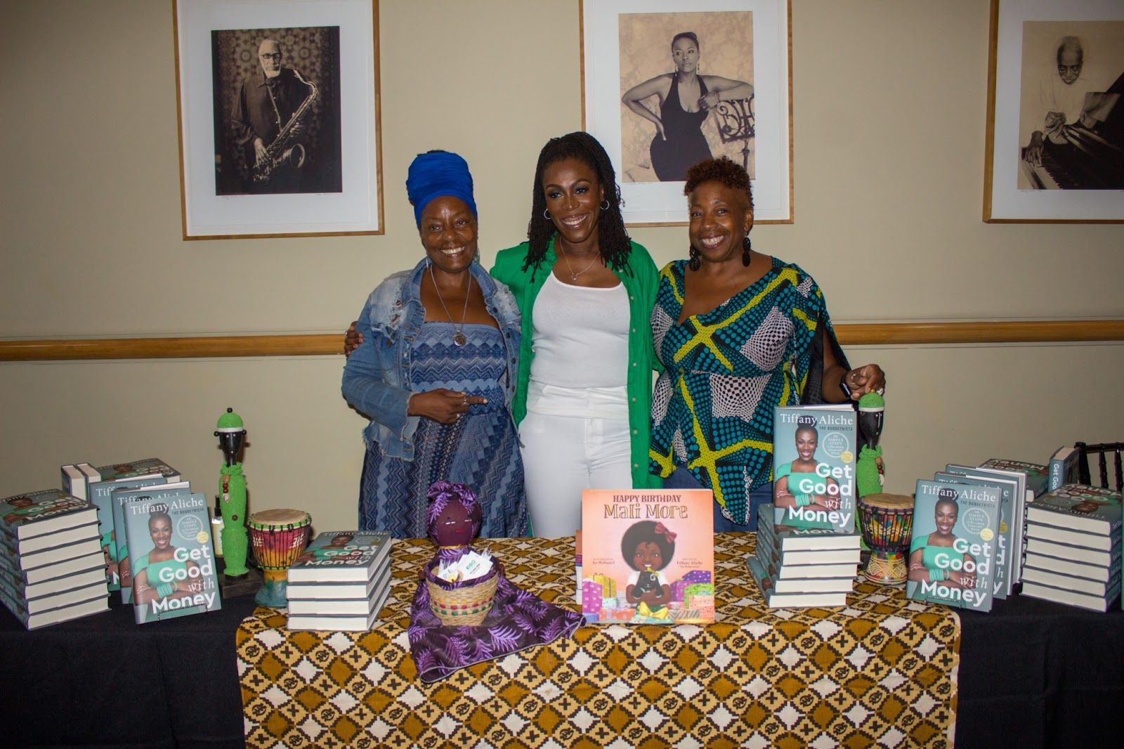 Aliche with Newark's Source of Knowledge Bookstore Owners. Photography by De'jah Monai Johnson.