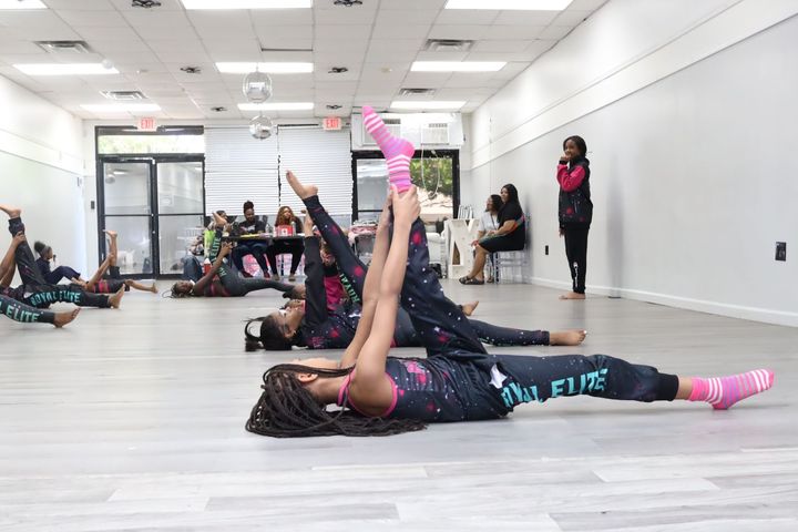 Royal Elite Dance Company stretching before practice. Photography by Ryan S. Cook.