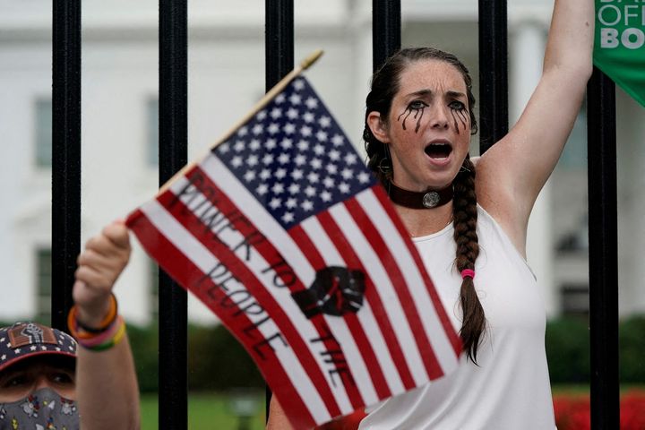 A demonstrator shouts outside the White House during a Women's March protest in the wake of the U.S. Supreme Court's decision